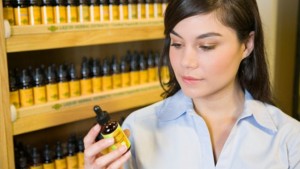 Woman reading label of organic product